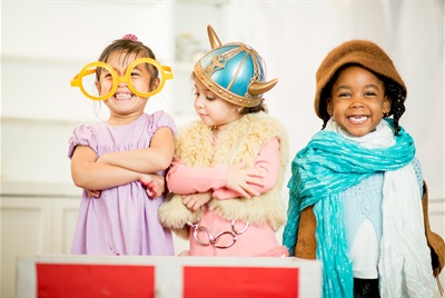 Three children dressed in costumes